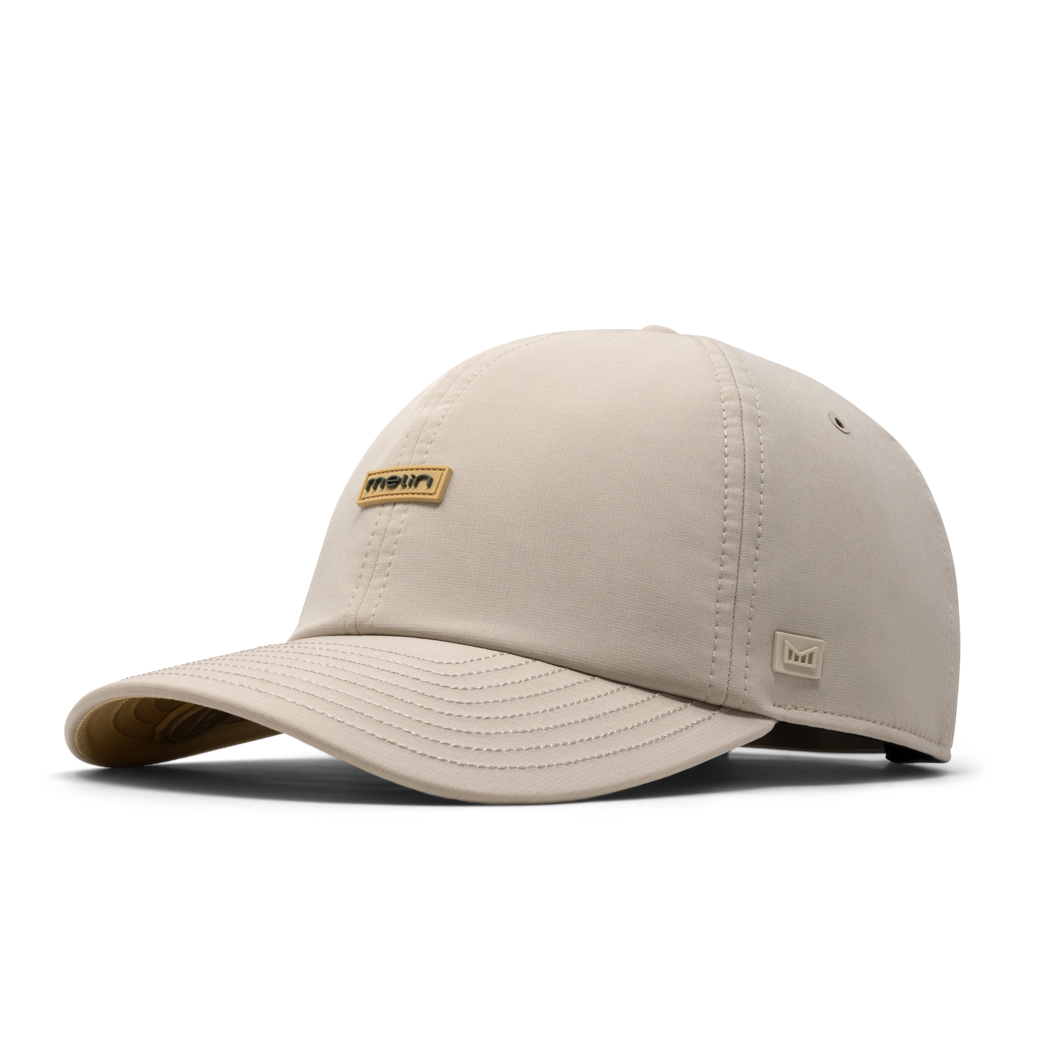 The front, angled view of the melin The Legend Hydro Performance Dad Hat in Sandshell
