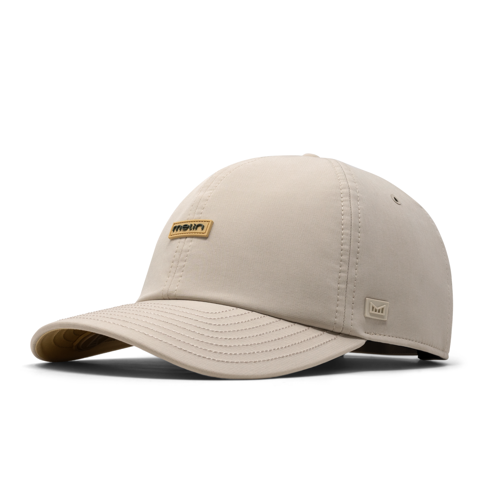 The front, angled view of the melin The Legend Hydro Performance Dad Hat in Sandshell