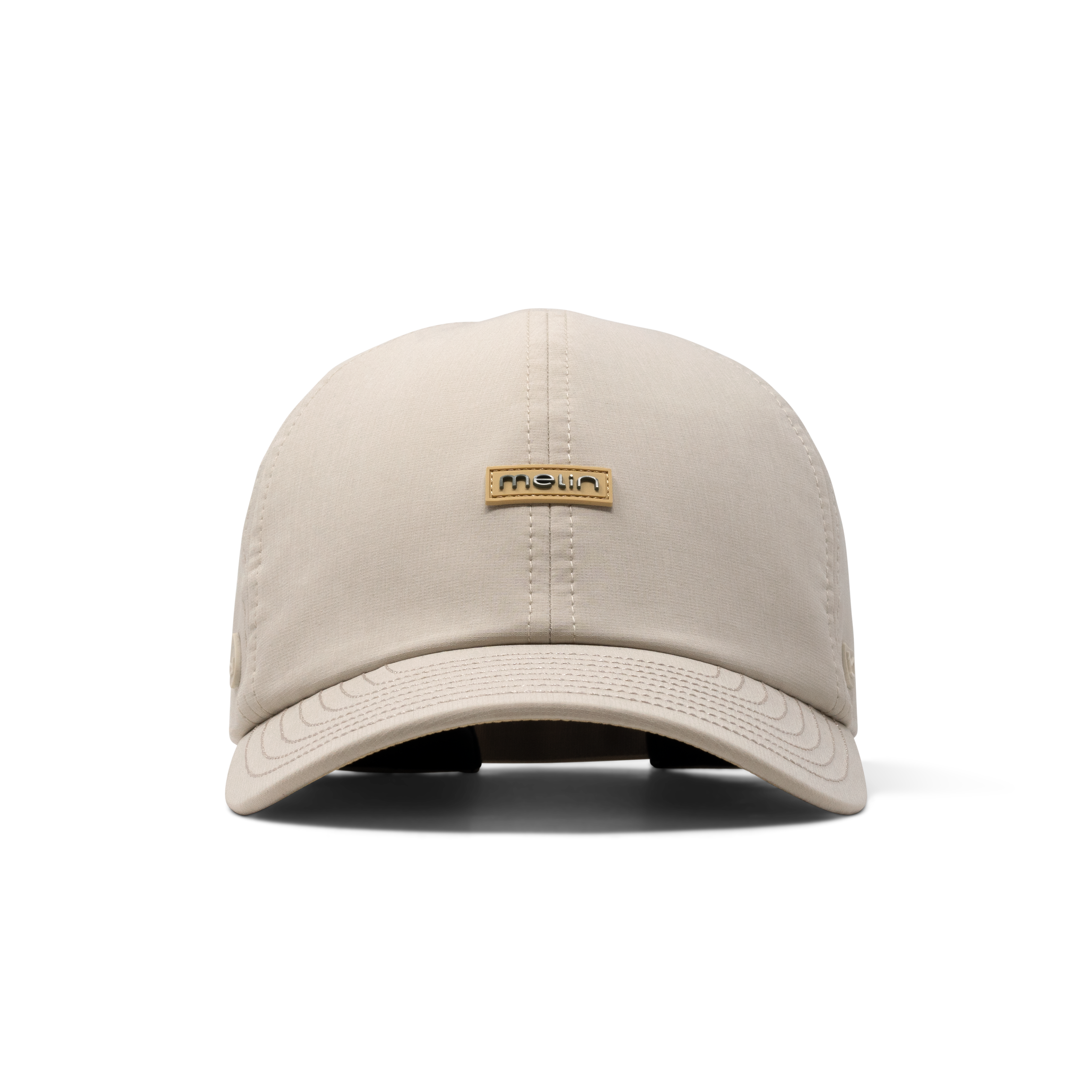 The front view of the melin The Legend Hydro Performance Dad Hat in Sandshell