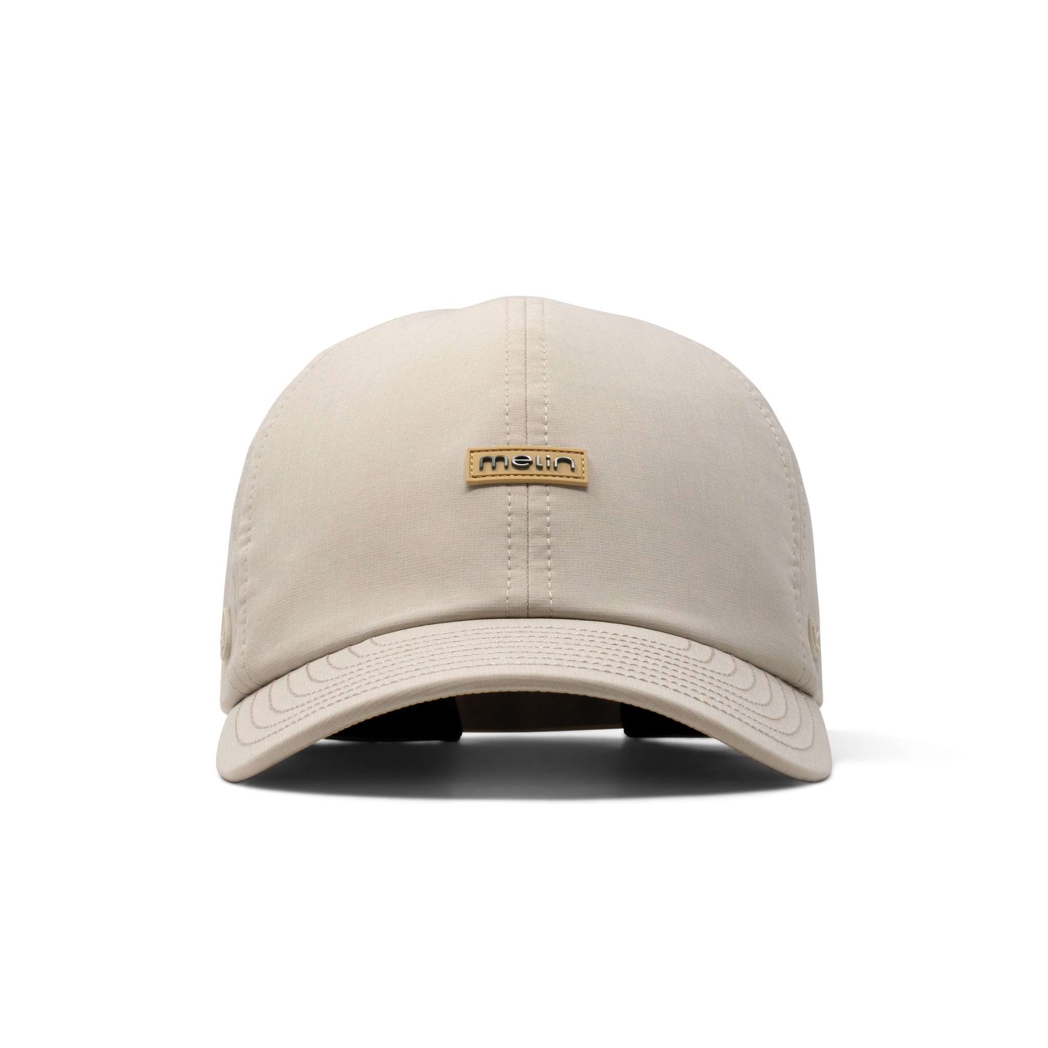 The front view of the melin The Legend Hydro Performance Dad Hat in Sandshell