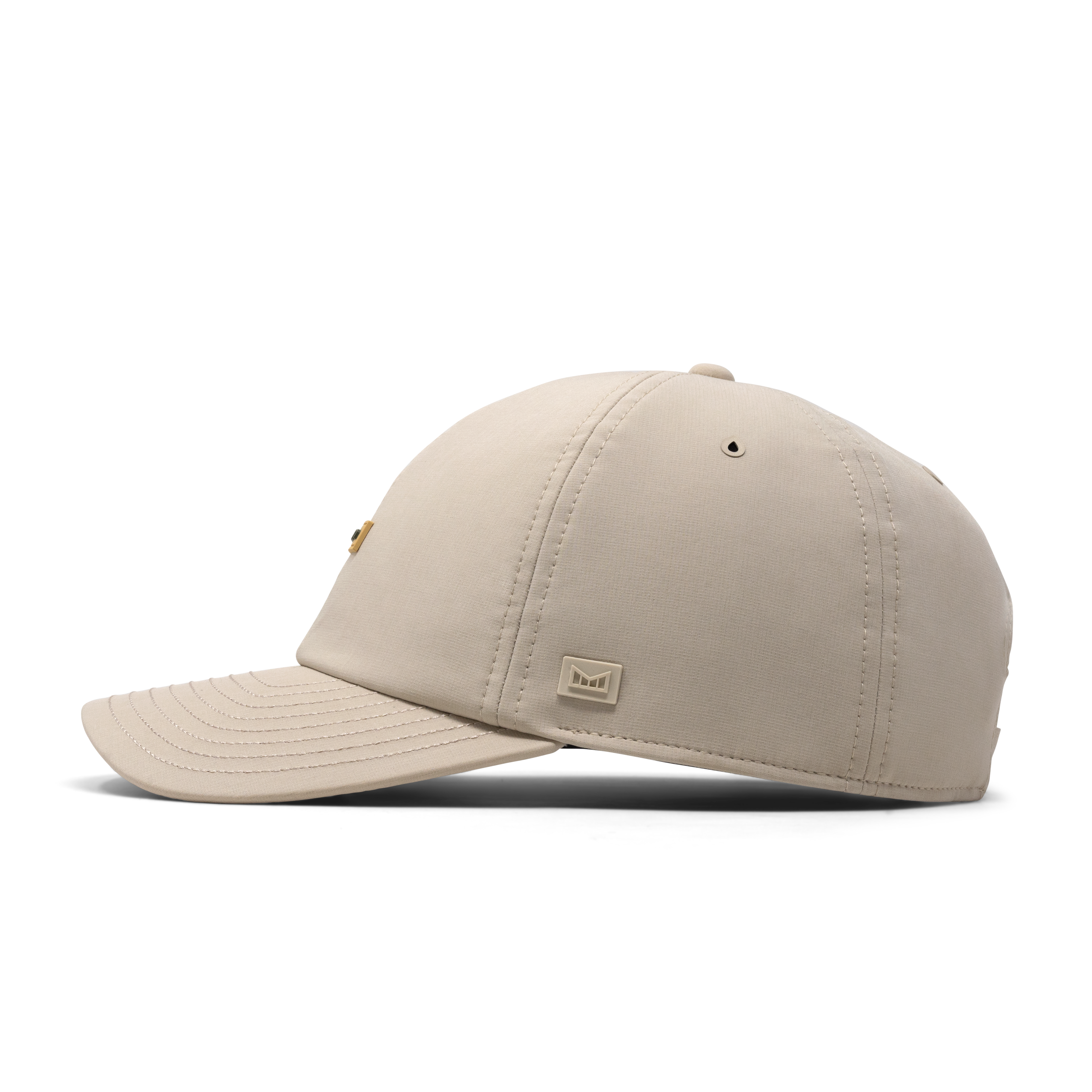 The side view of the melin The Legend Hydro Performance Dad Hat in Sandshell