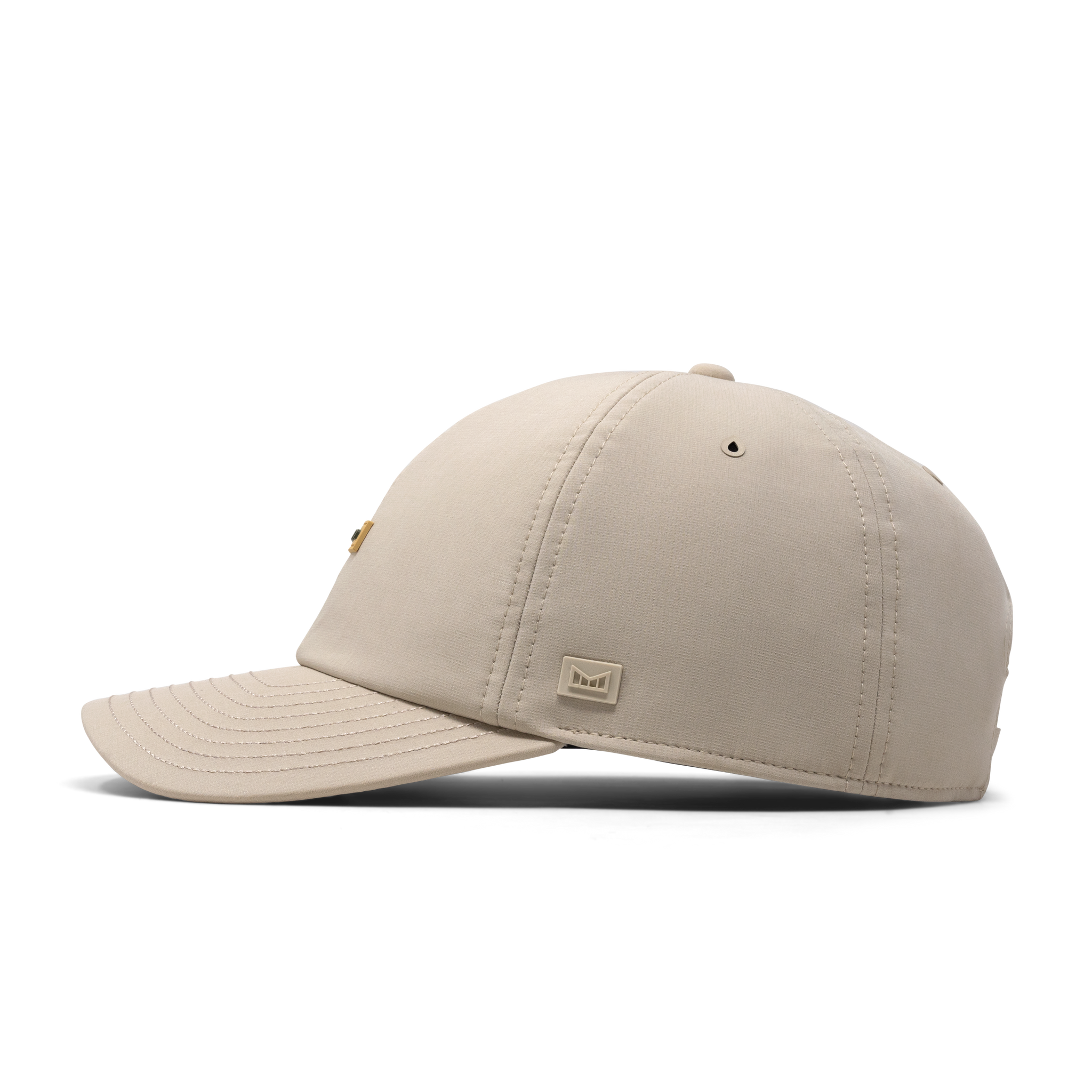 The side view of the melin The Legend Hydro Performance Dad Hat in Sandshell