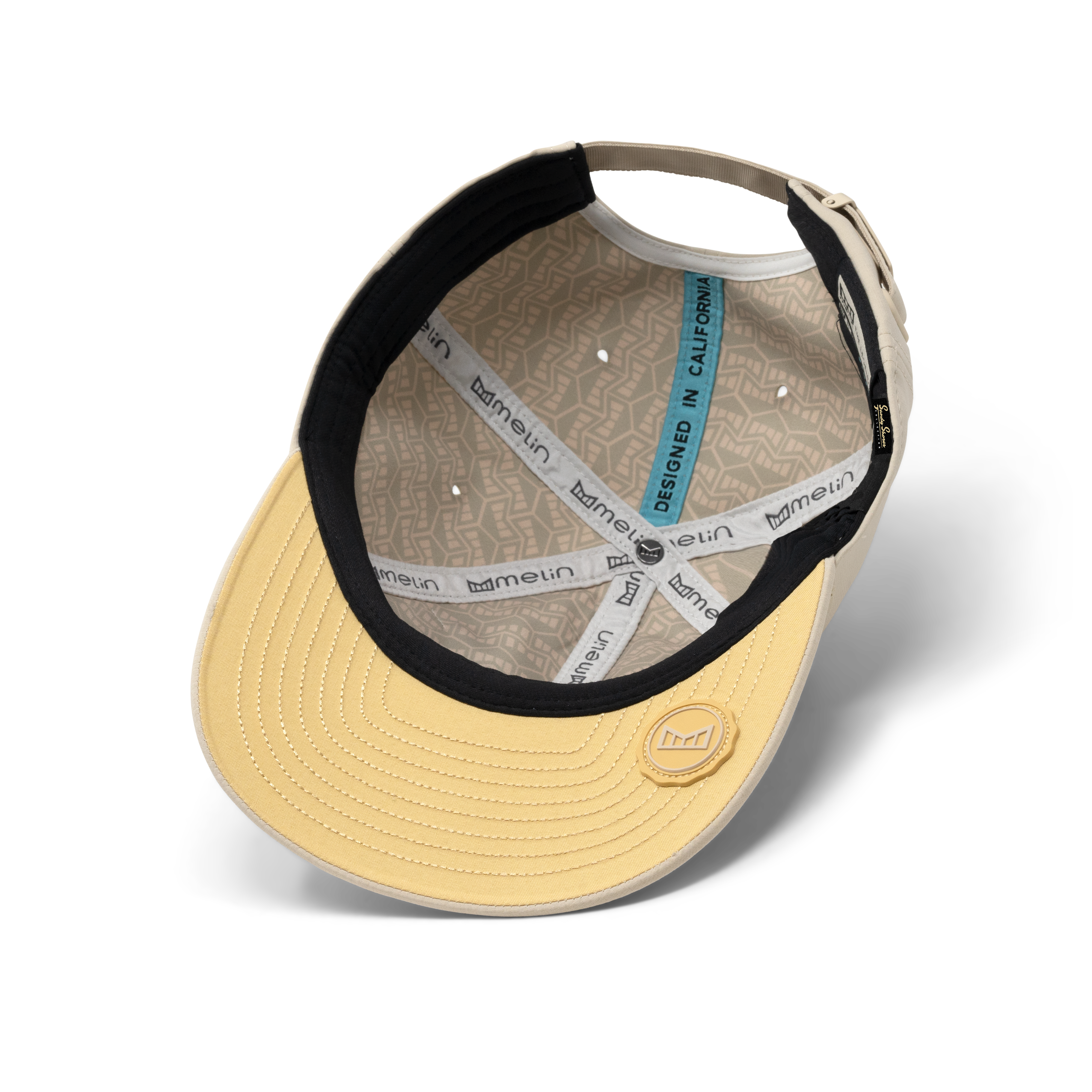 The inside view of the melin The Legend Hydro Performance Dad Hat in Sandshell